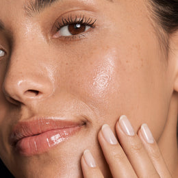 Applying a few drops of Root Mute Oil to the chin